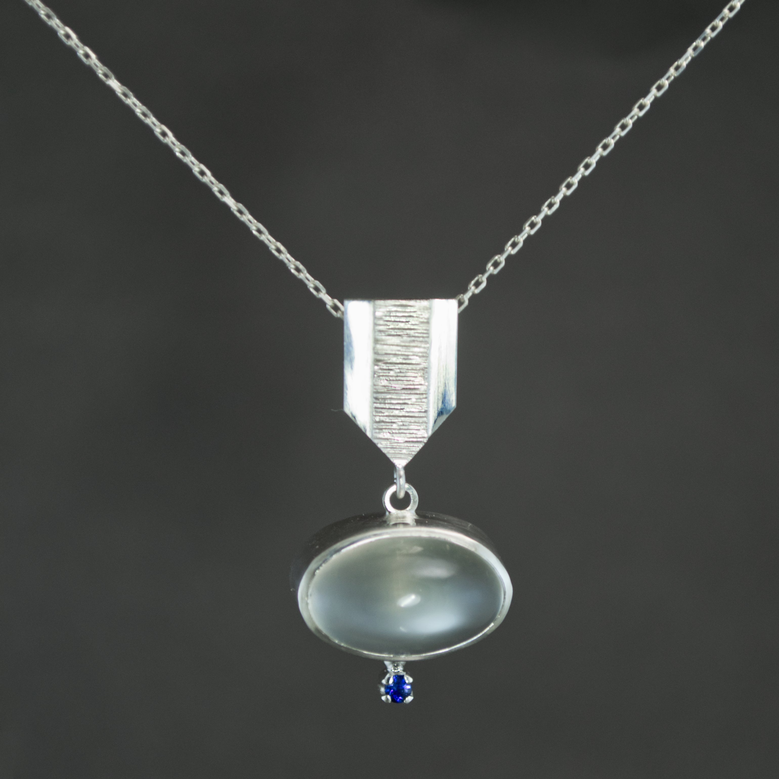 White Moonstone and Sapphire Dart Pendant