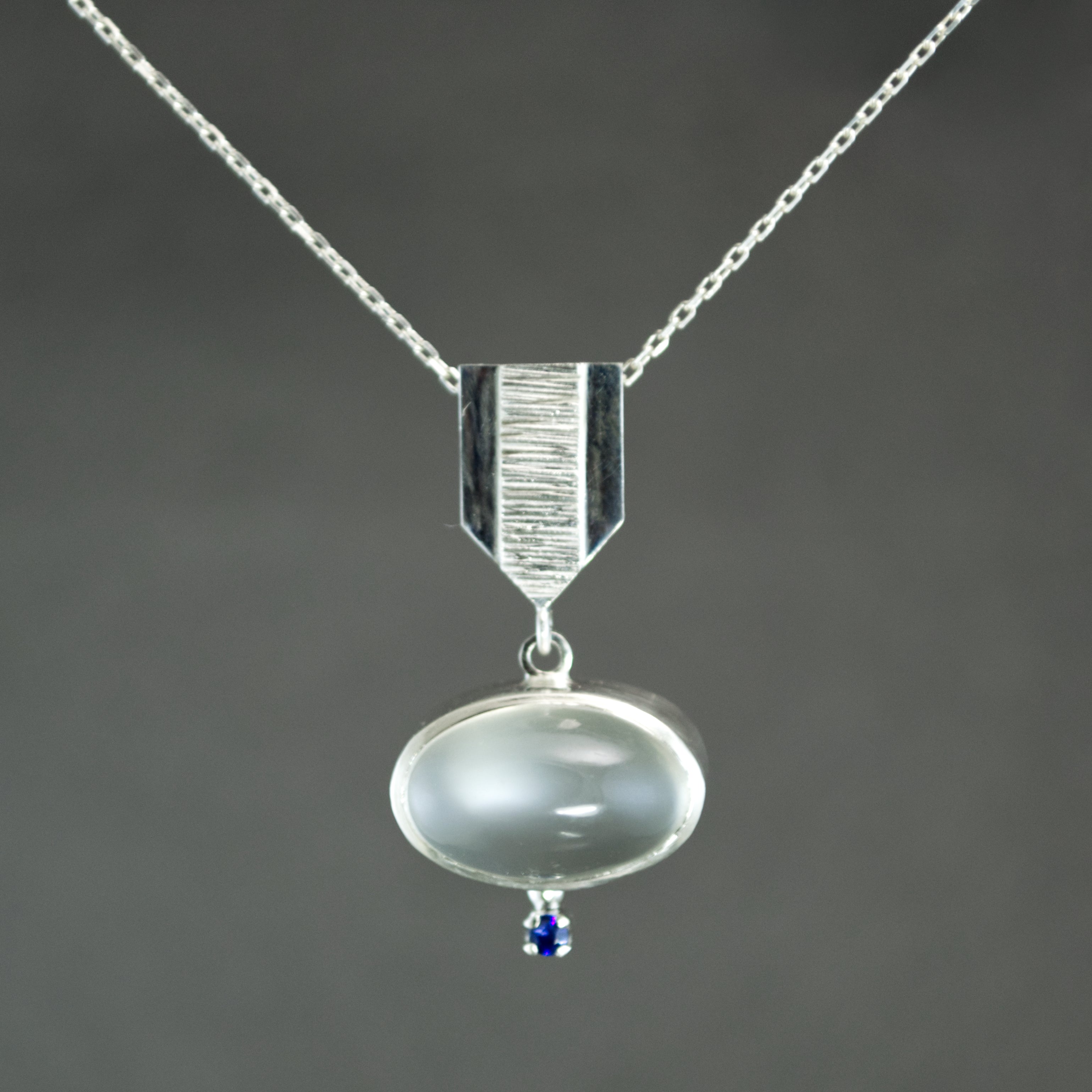 White Moonstone and Sapphire Dart Pendant