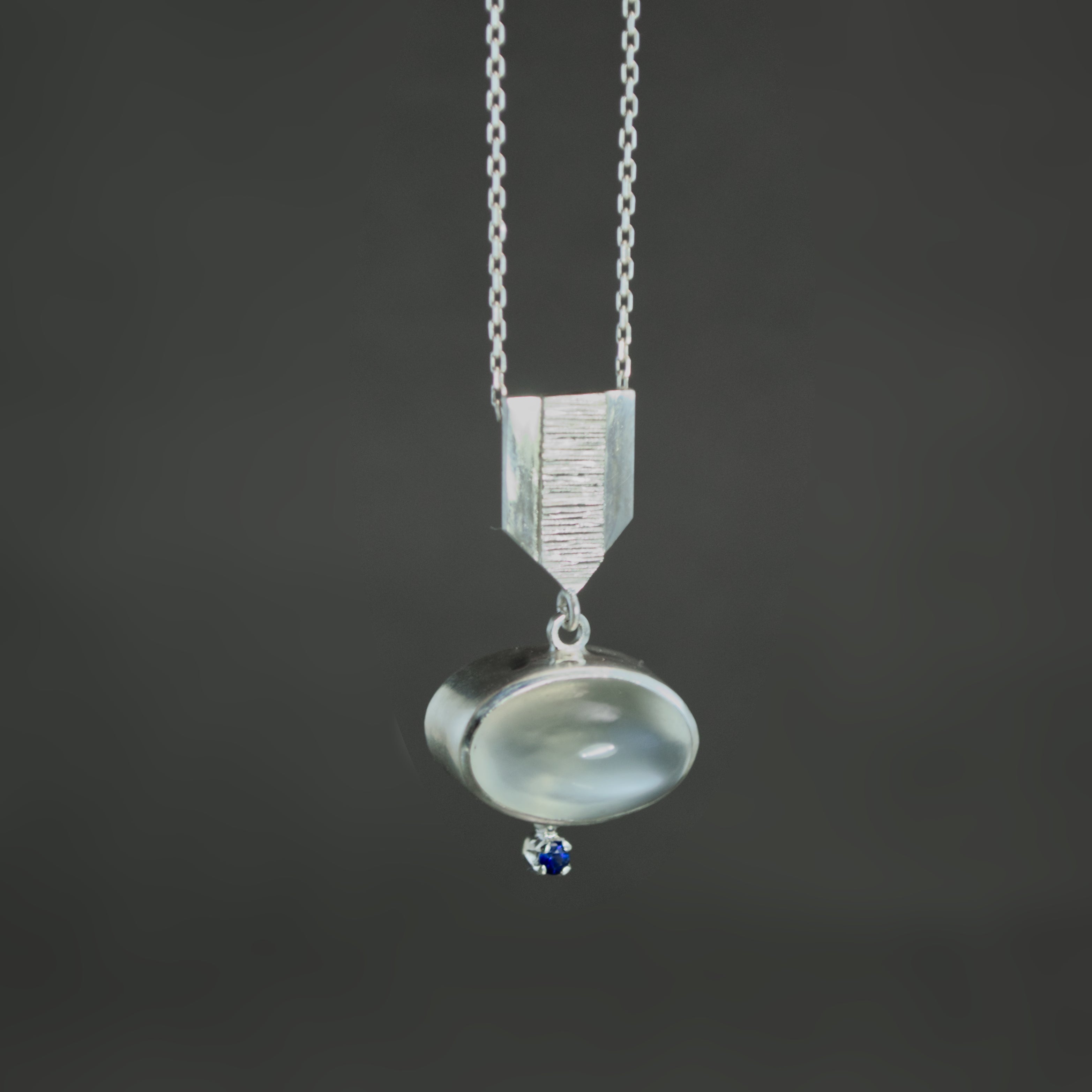 White Moonstone and Sapphire Dart Pendant
