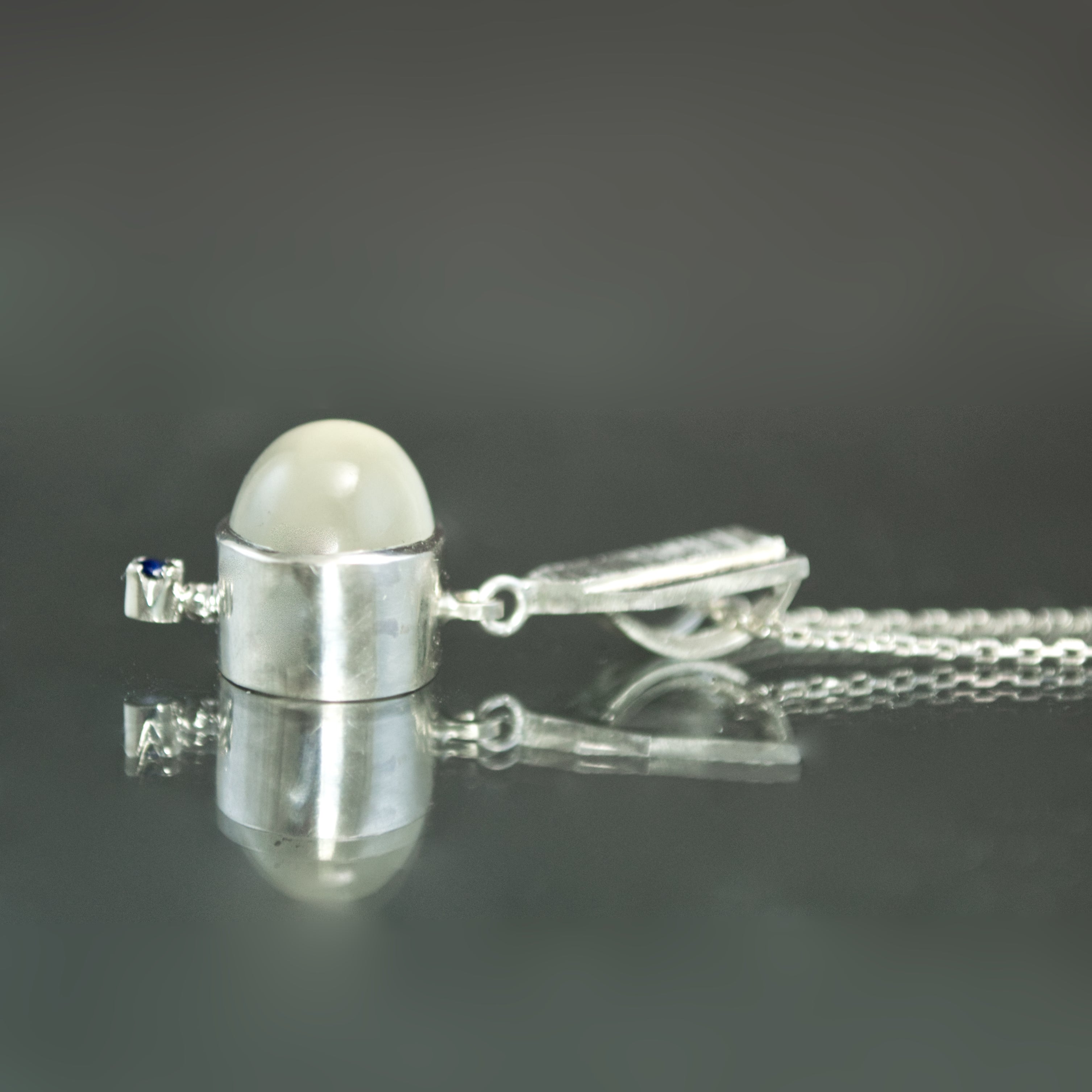 White Moonstone and Sapphire Dart Pendant