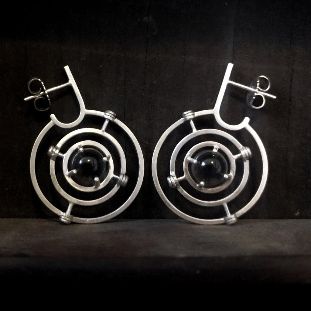 Kinetic planetary hoop earrings