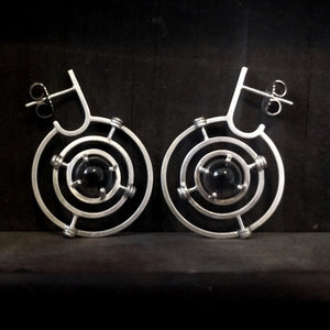 Kinetic planetary hoop earrings